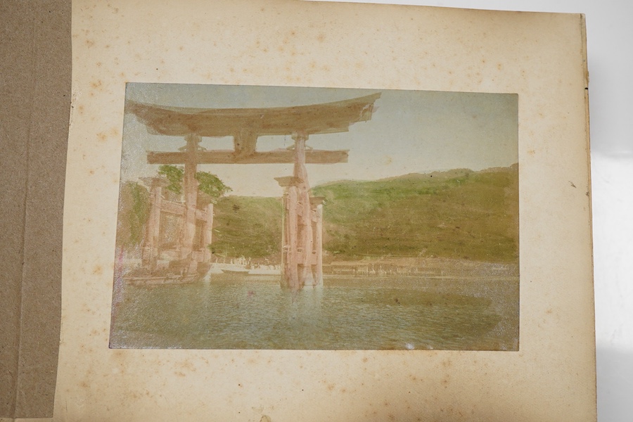 An early 20th century Japanese bone inlaid lacquer photograph album containing coloured photographs of people and Japanese scenes.19.5cm wide x 15.5cm high